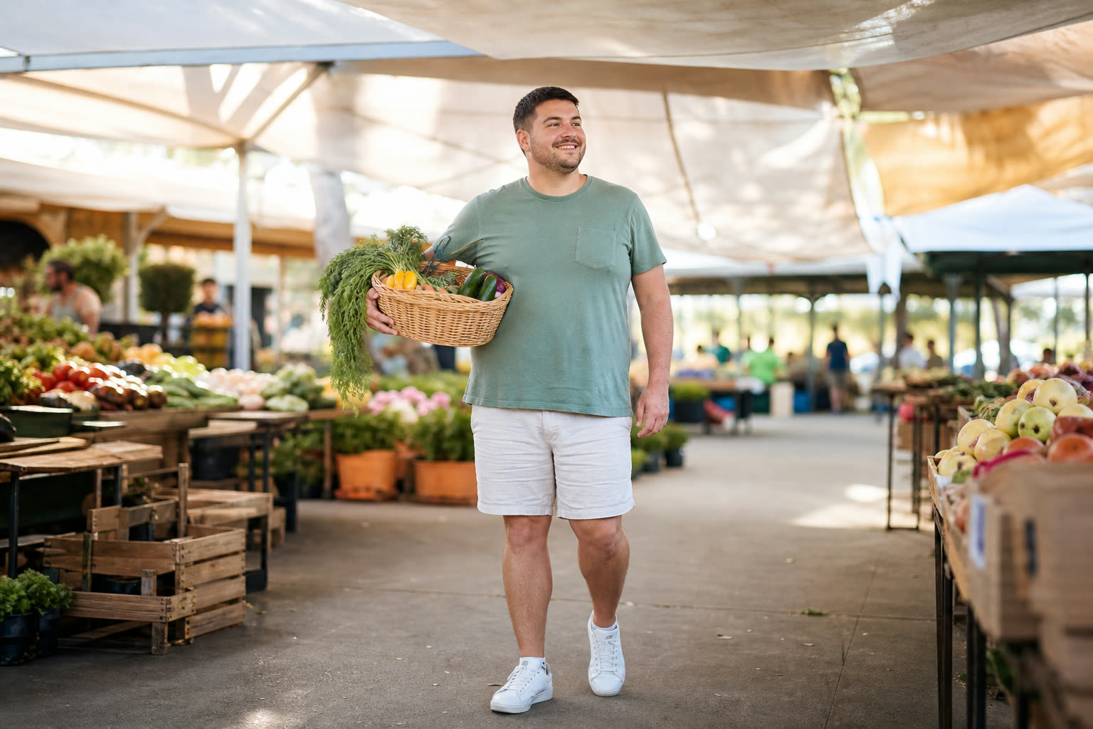 A mid-20s man with a stocky build carrying a basket of produce through a farmers market, easy confidence