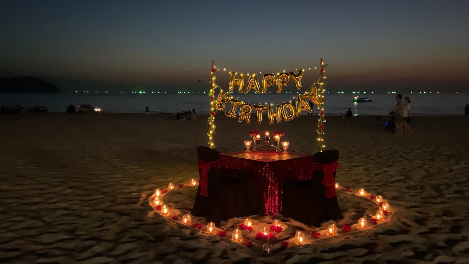 Candlelight glowing softly across a table set for two