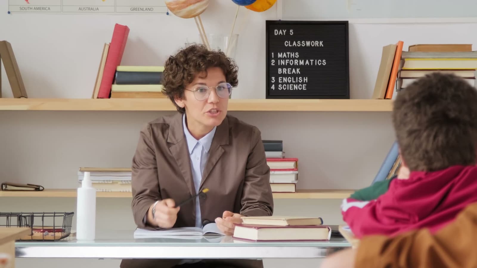 A teacher leading a lesson with students in a classroom
