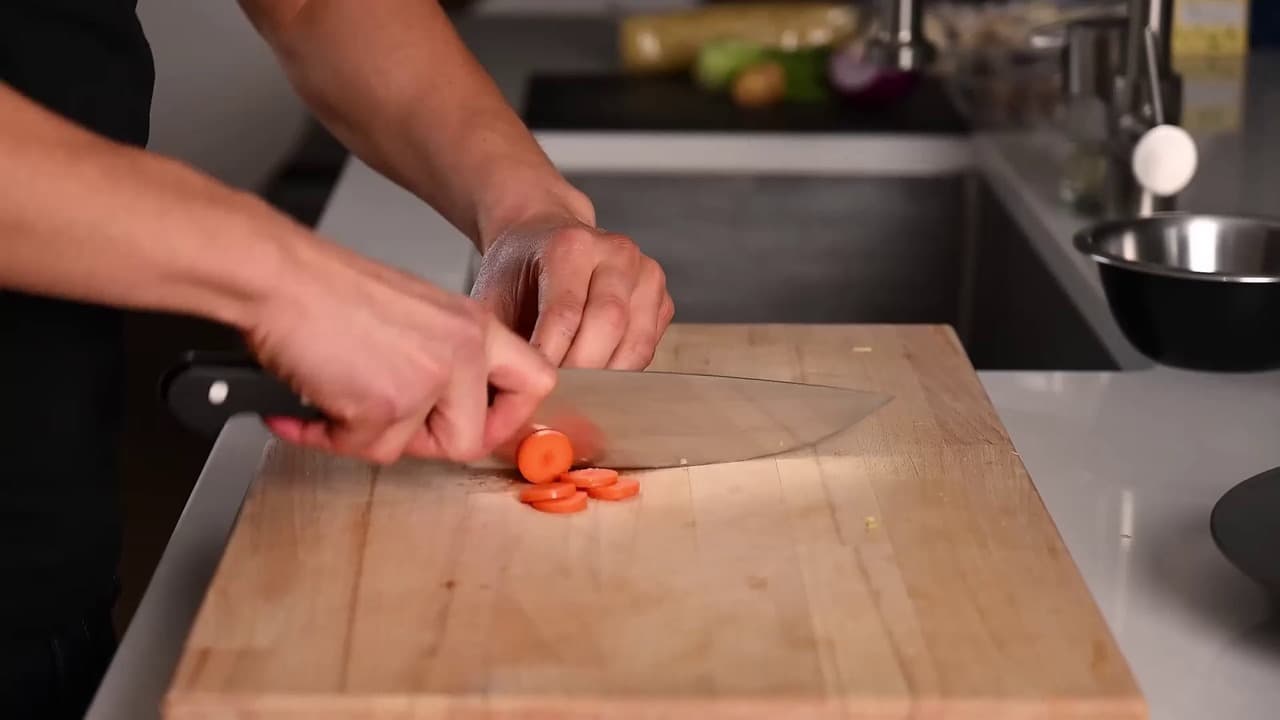 Close, appetizing footage of fresh vegetables being prepared in a home kitchen